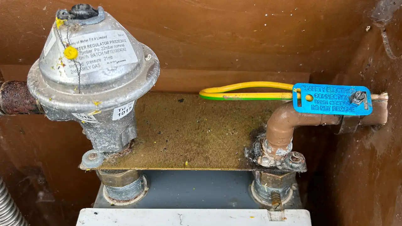 Gas meter bonding installation in progress